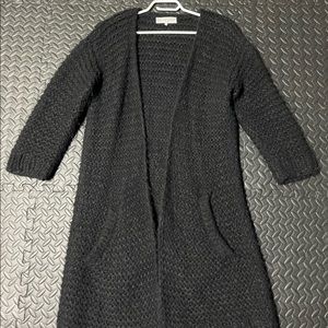 A piece apart, long black cardigan, M